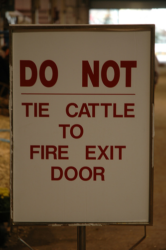 Do not tie cattle to fire exit door